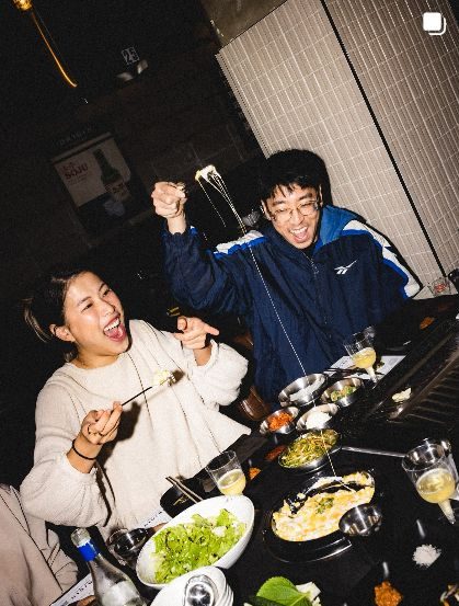 Couple laughing at the grill table
